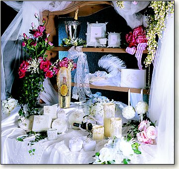 B. B. World, and we're celebrating by offering New Floral Items, Silver-Plated Bridal Gifts, Bridal Table Accents, Beautiful Ribbon, and more..